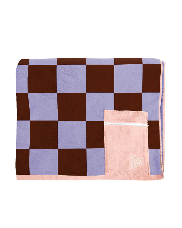 Checkered blanket with a pink pouch on a white background
