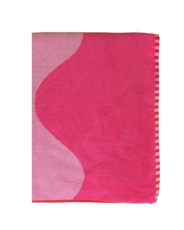 Pink and white patterned towel on a white background