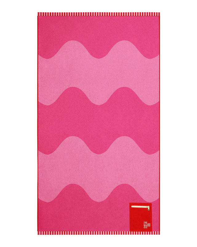 Pink and red striped towel with a brand logo on a white background