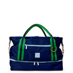 Blue duffel bag with green straps on a white background