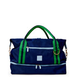 Blue duffel bag with green straps on a white background