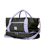 Black duffel bag with purple straps and accents on a white background