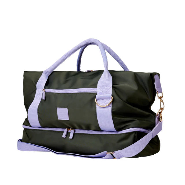 Black duffel bag with purple straps and accents on a white background
