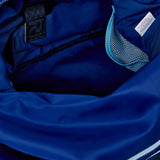 Close-up of a blue jacket with a brand label and zipper details.