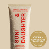Sunscreen tube for babies and children with 'Sun & Daughter' branding on a beige background