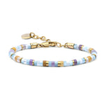 Multicolored beaded bracelet with gold accents on a white background