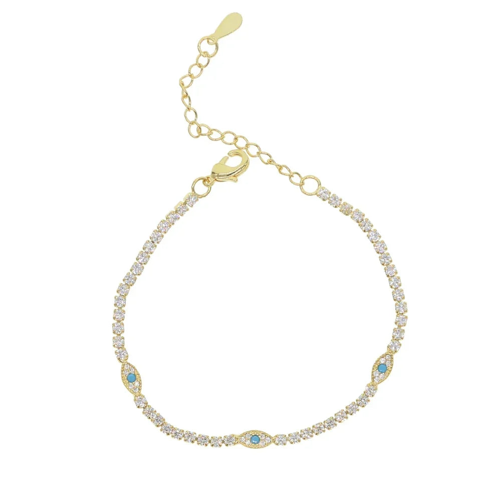 Gold bracelet with gemstones on a white background