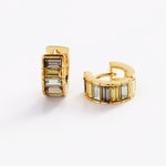 Gold hoop earrings with rectangular gemstones on a white background