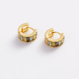 A pair of gold huggie hoop earrings with rectangular iridescent stones, displayed on a clean white background.