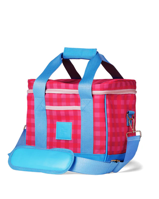Pink and blue checkered bag with a blue handle on a white background