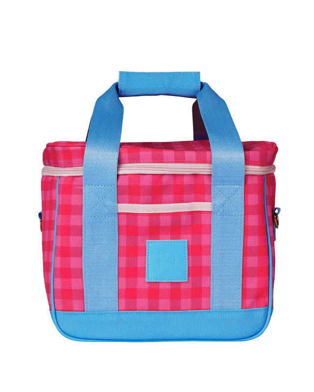 Pink and blue checkered bag with a solid blue square on a white background