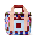 Colorful checkered bag with pink handles on a white background