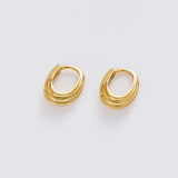A pair of gold-toned, multi-strand hoop earrings on a clean, light gray background.