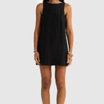 Woman wearing a black sleeveless dress on a white background