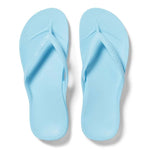 Pair of light blue flip-flops on a white background