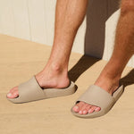 person wearing slides