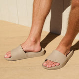 person wearing slides