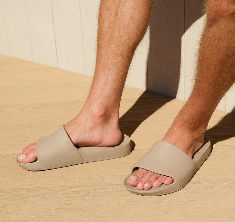 person wearing slides