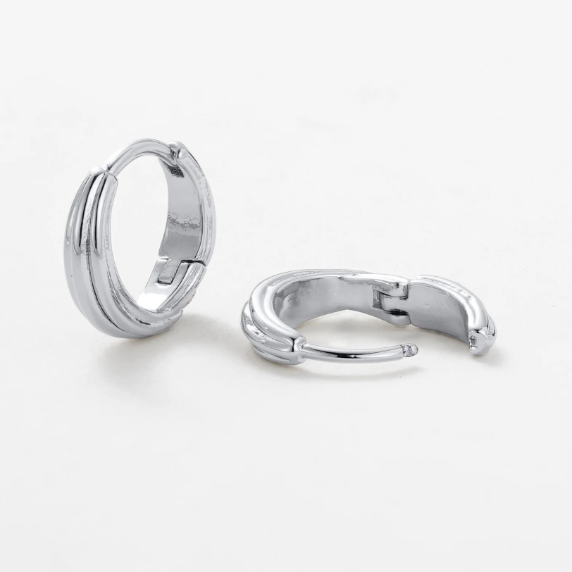 Pair of silver hoop earrings on a white background