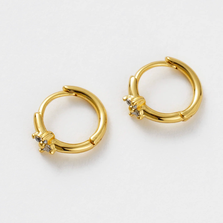Small gold hoop earring with crystal detail