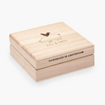 Wooden box with 'Pig & Hen' branding and 'Handmade in Amsterdam' text on a white background
