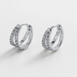 Pair of silver hoop earrings with embedded stones huggie hoop style
