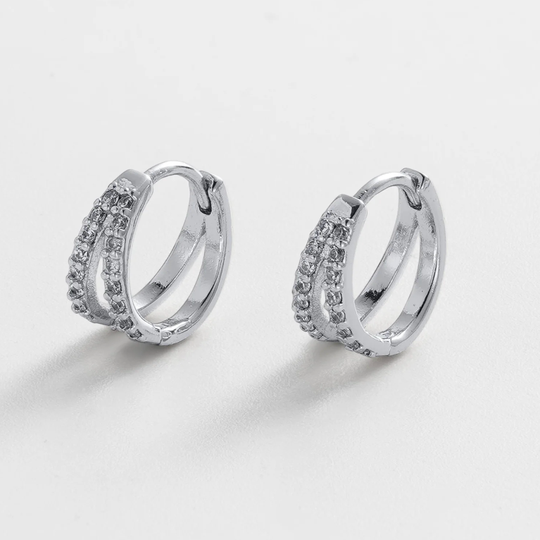 Pair of silver hoop earrings with embedded stones huggie hoop style